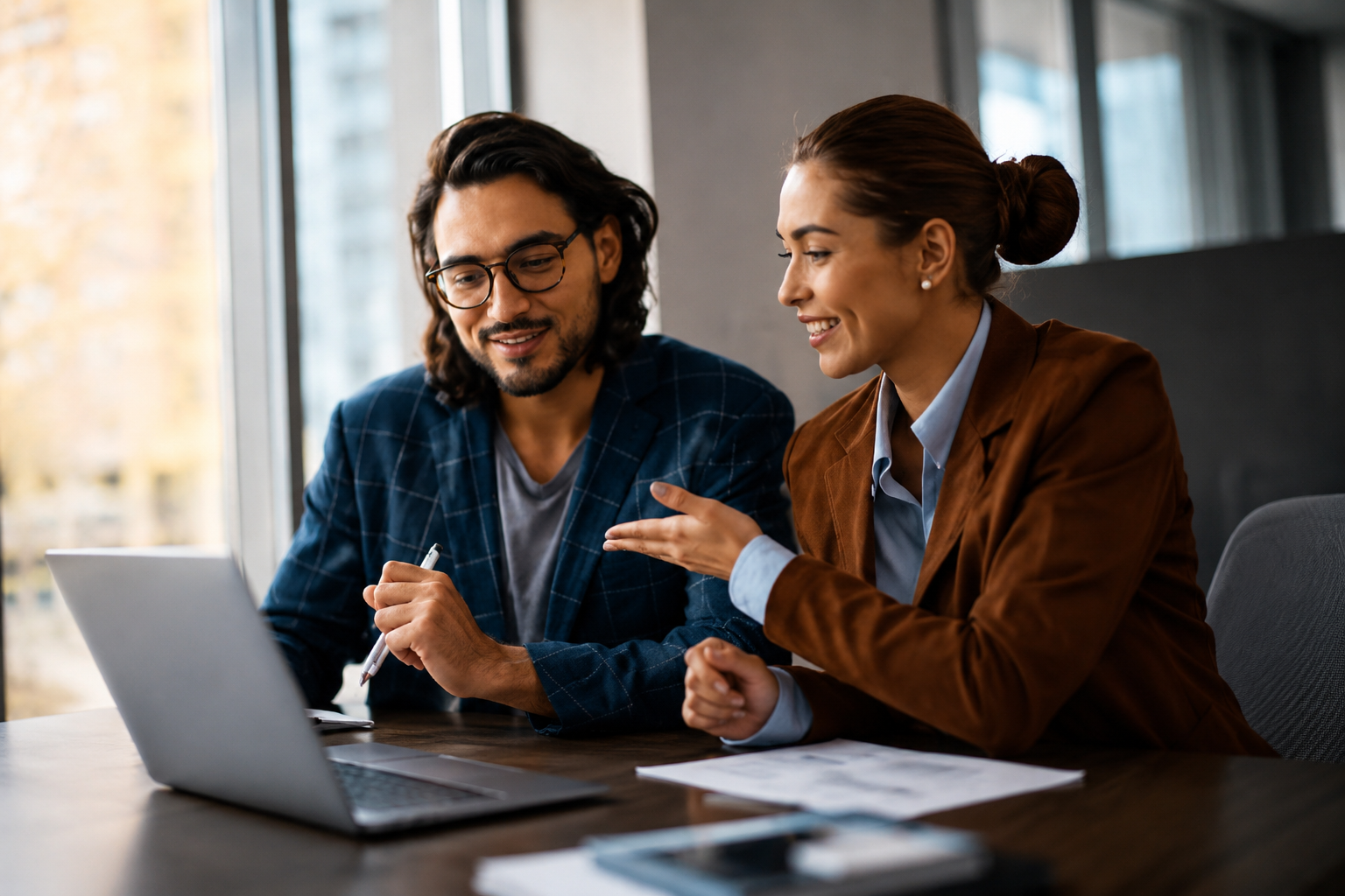 Manager and new hire reviewing onboarding work together